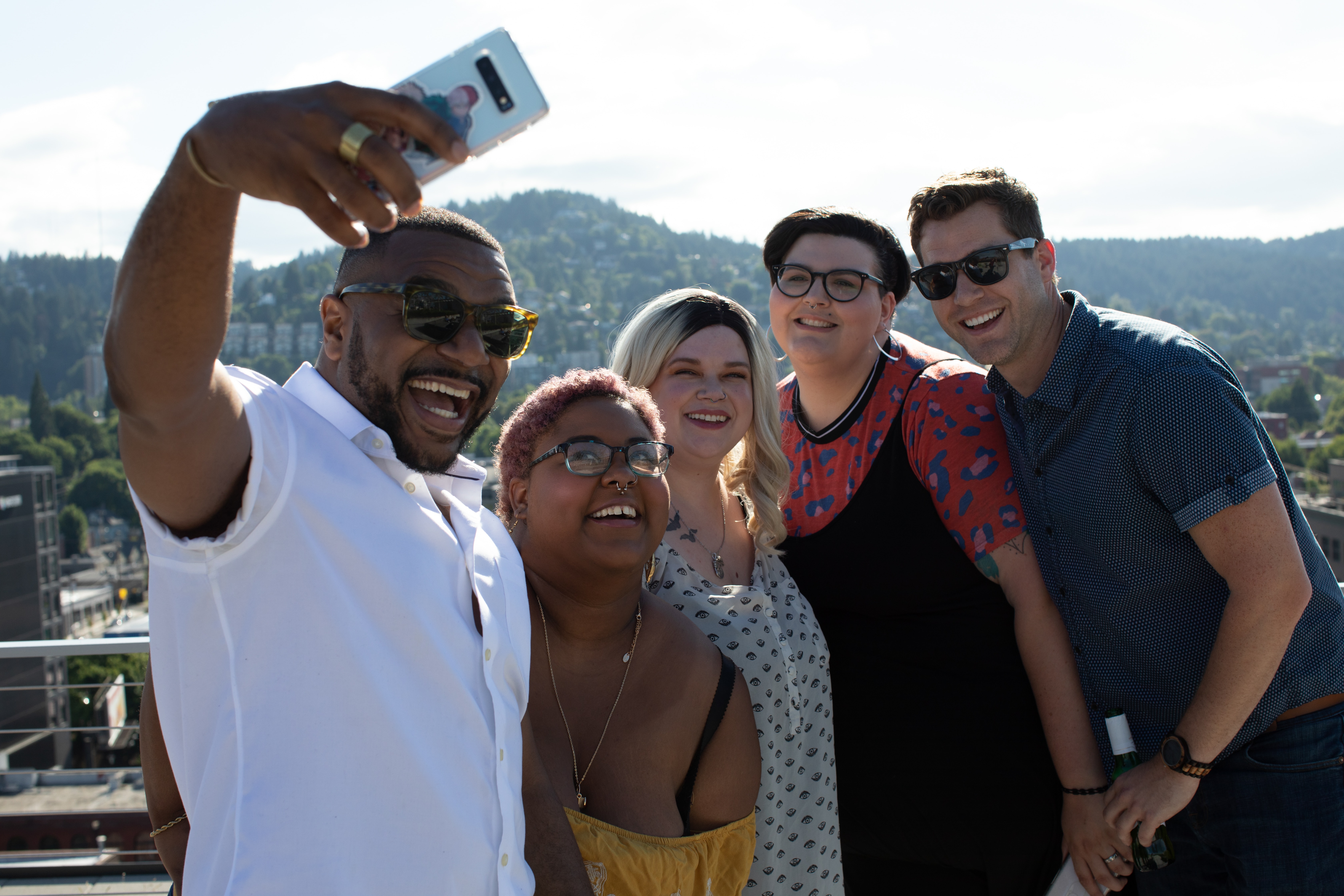 People taking a group photo on a phone